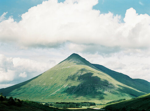 Picturesque landscape with triangle mountain