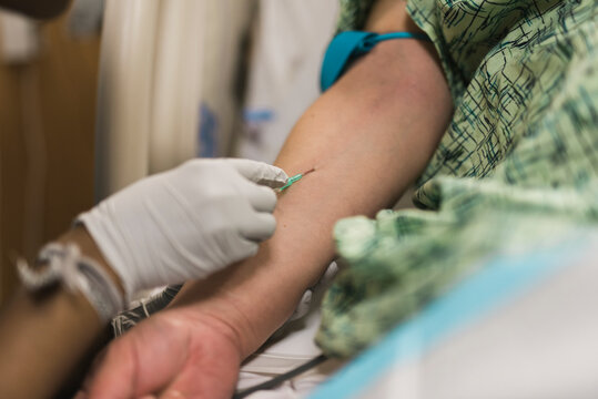 Inserting IV Drip