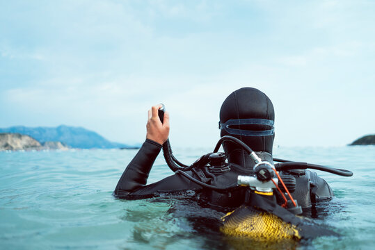 Scuba Diver Holding Regulator