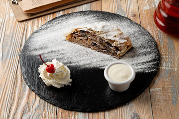 Traditional austrian strudel with apples, honey, cinnamon and raisins, food magazine photo for recipe