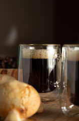 cups of coffee and bread on the wooden board