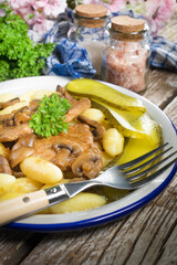 Braised pork loin with mushrooms.