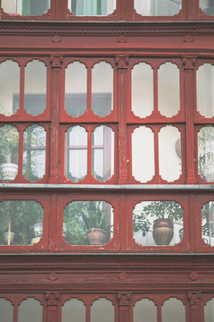 Red vintage enclosed balcony on Bilbao, Spain.