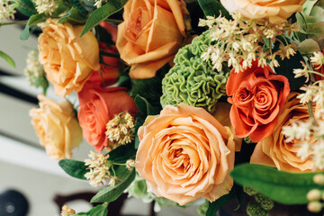 Bouquet of roses at a fall decorated table