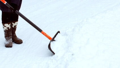 Cleaning of a snow. Clearing of road to winter time by means of a shovel