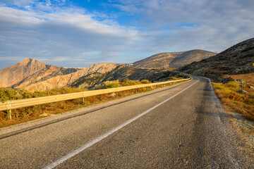 The road on the island of Folegandros at sunset light. Cyclades, Greece