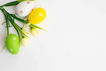 Easter Holidays background. Easter eggs with flowers