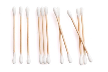 Eco-friendly materials. Wooden, cotton swabs on a white background. Close-up.