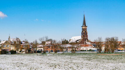 Winter view of the Saint-Gérard church and the Wattrelos district of Touquet-Saint-Gérard in France. Department Nord-Pas-de-Calais.