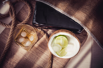 bottle of rum with lime ice and coconut