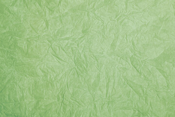 Fototapeta premium Old crumpled green paper background texture