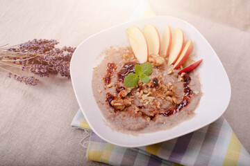 Buckwheat porridge with apple slices and walnuts