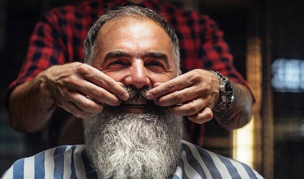 Barber Shaping a Beard