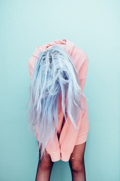 Woman in Pink Sweatshirt Flying Her Blue Hair