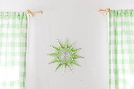Green clock and curtains