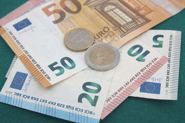 Closeup of some euro bills and coins