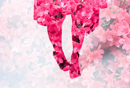 Legs and feet of a girl standing in colorful pink flower garden