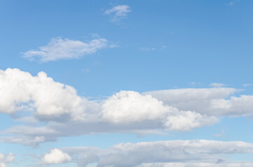 White clouds in a bright blue sky. The beauty of the nature