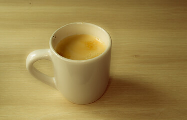 A coffee mug with coffee and milk