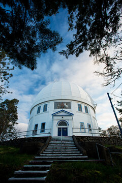 Stairs leading up a an observatory before sunrise