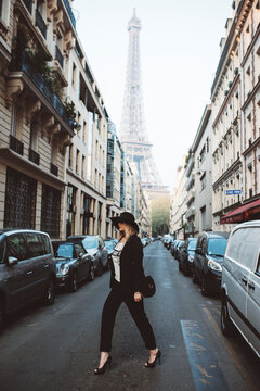 Fashionable young woman and the Eiffel Tower