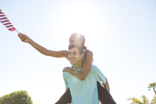Young couple with American flag.