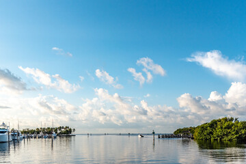 A beautiful calm day at Matheson Hammock Marina in Miami. Boat heads out on a calm Summer day.
