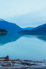 Canoe on a lake and mountains