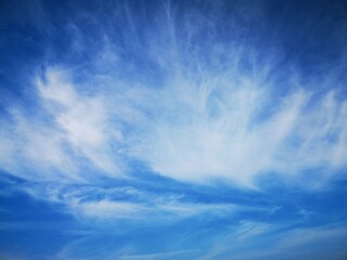 blue sky with feathery white clouds nature