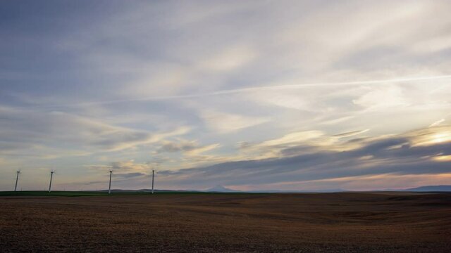 Wind Turbines on wheat field time lapse