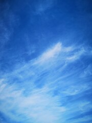 blue sky with feathery white clouds nature