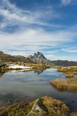 Ibon de Anayet and the Portalet with the bottom the Anayet peak. Concept famous mountains of the...