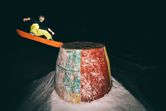 Snowboard jump. Freestyle snowboard trick on snowpark. Extreme sport