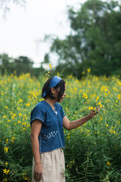 Asian woman wearing natural indigo dye cloth.