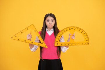 funny child girl study geometry at school lesson with protractor and triangle, stem disciplines