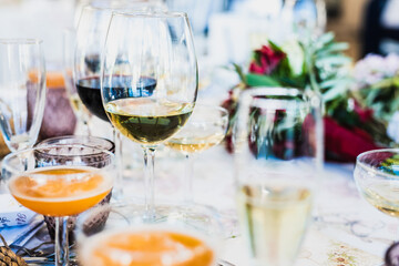 Glasses arranged on the diners table at a celebration of a party.