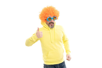 Funny man wear funky wig hair with party sunglasses showing thumbs up hand gesture, approval