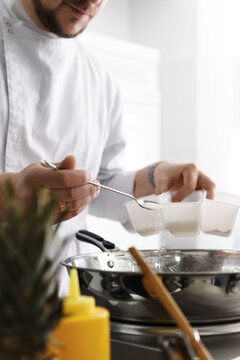 Cook seasoning food on pan