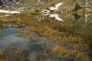 Ibon de Anayet and the Portalet with the bottom the Anayet peak. Concept famous mountains of the Aragonese Pyrenees