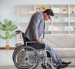 Dsabled businessman on wheelchair working home