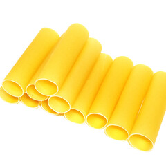 Yellow cannelloni pasta isolated on white background