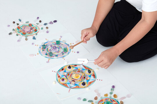 Mandala pattern, watercolor painting. with crystal and hand