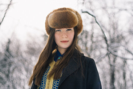 Portrait of a beautiful girl wearing winter hat