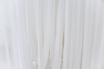Background texture of white, airy stripes of chiffon fabric, tulle. Neutral colors. Minimalist...