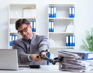 Busy employee chained to his office desk