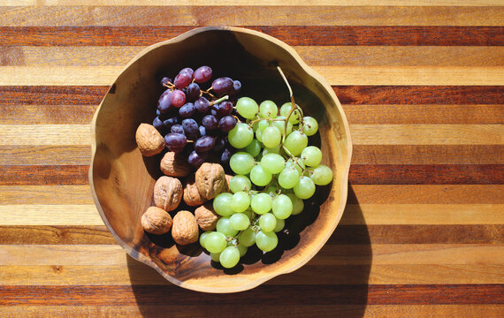 bowl with grapes, blueberries and walnuts