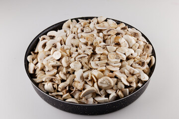 sliced fresh mushrooms in a pot