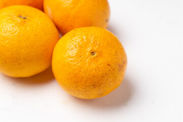 Orange fruit on white background