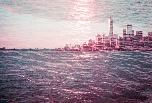 New York City skyline with skyscrapers covered in water at sunset