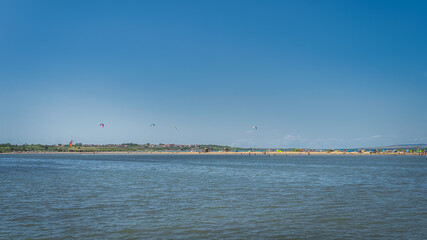 View on Zdrijac beach between Nin bay and Adriatic Sea with kite surfers, relaxing and sunbathing people, Croatia